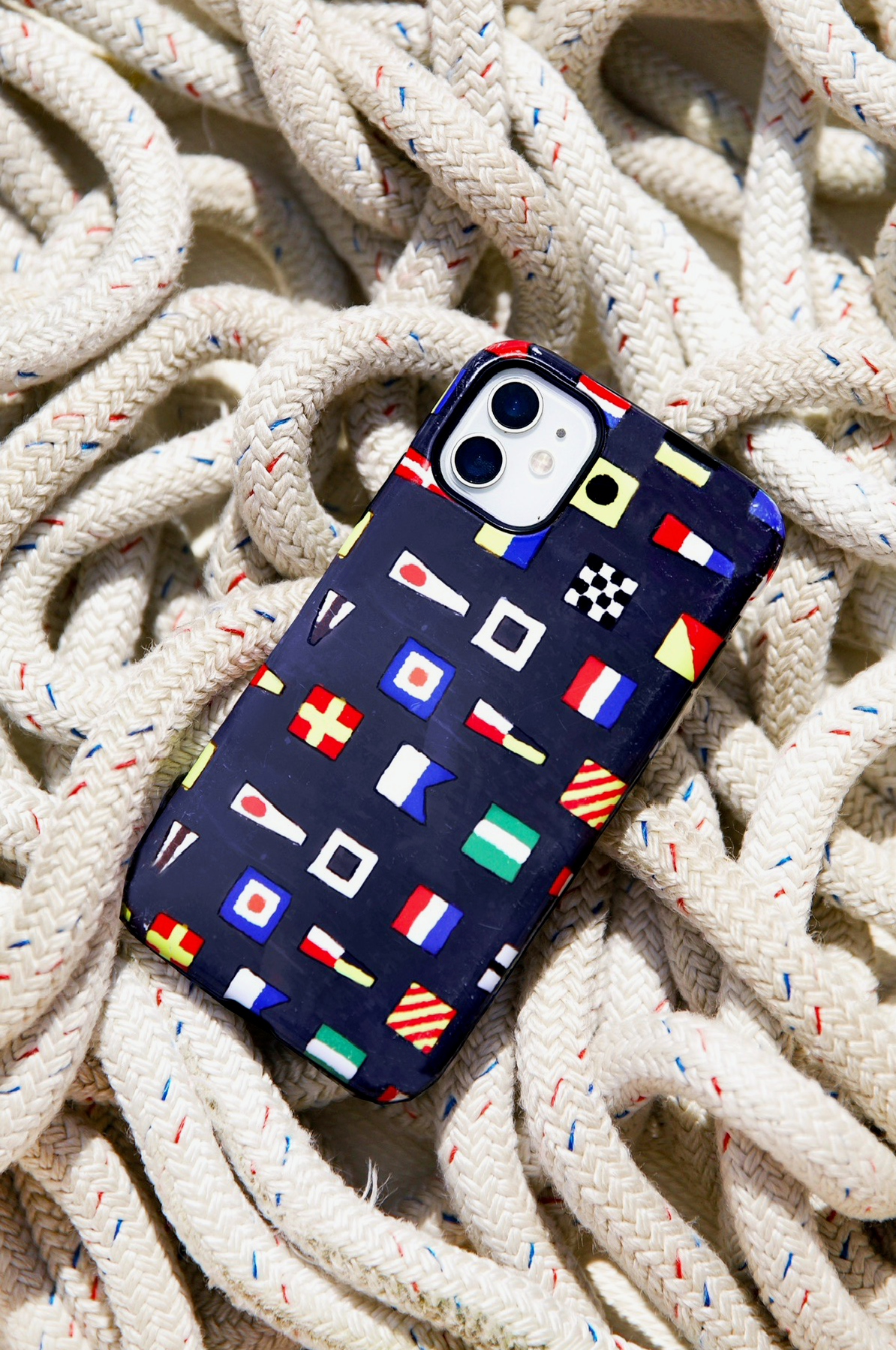Phone case with nautical flags design